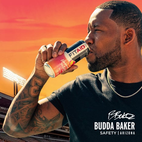 Budda Baker drinking a can of Fitaid Hawaiian Nectar.