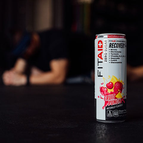 A can of FITAID with fitness equipments.