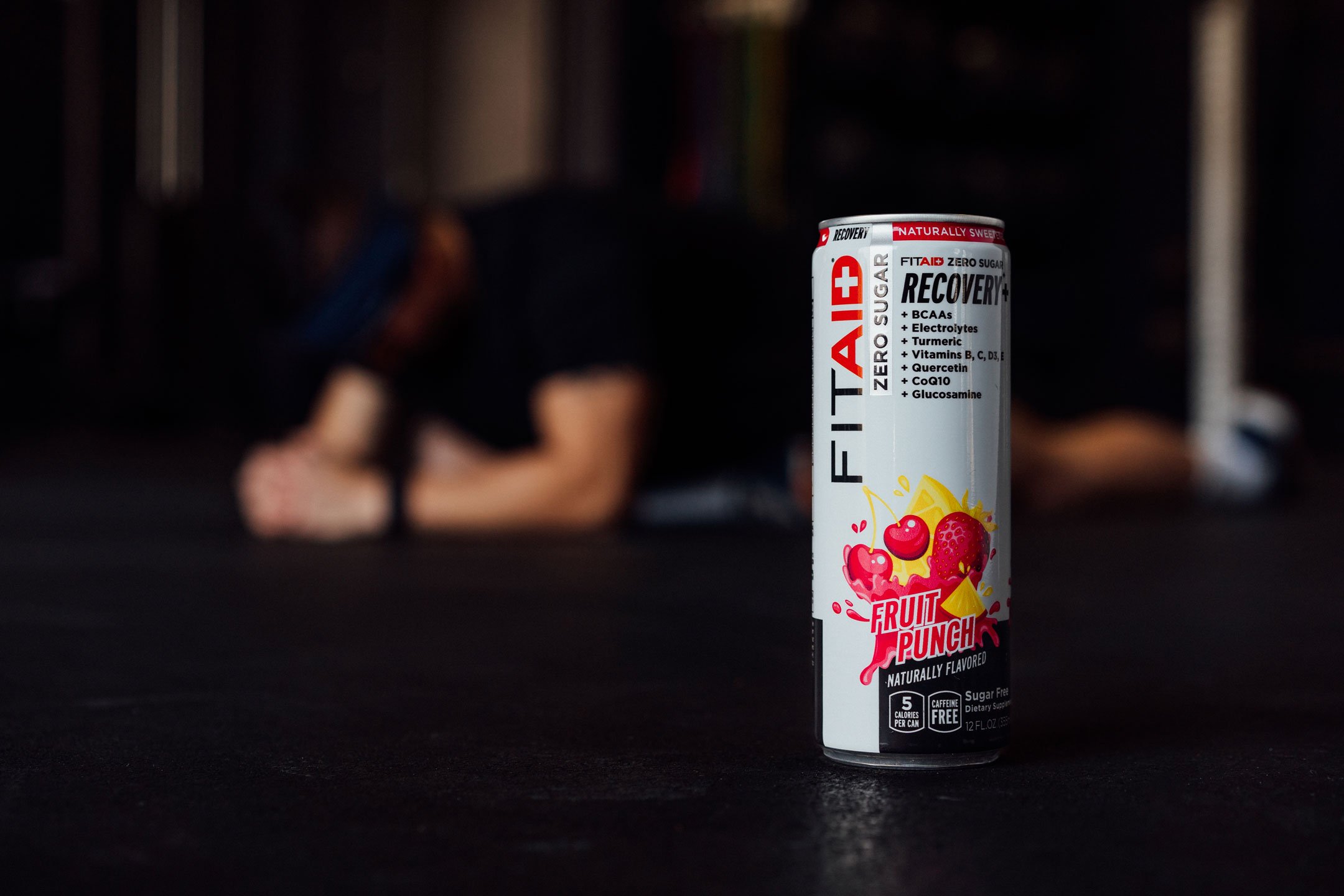 A can of FITAID with fitness equipments.