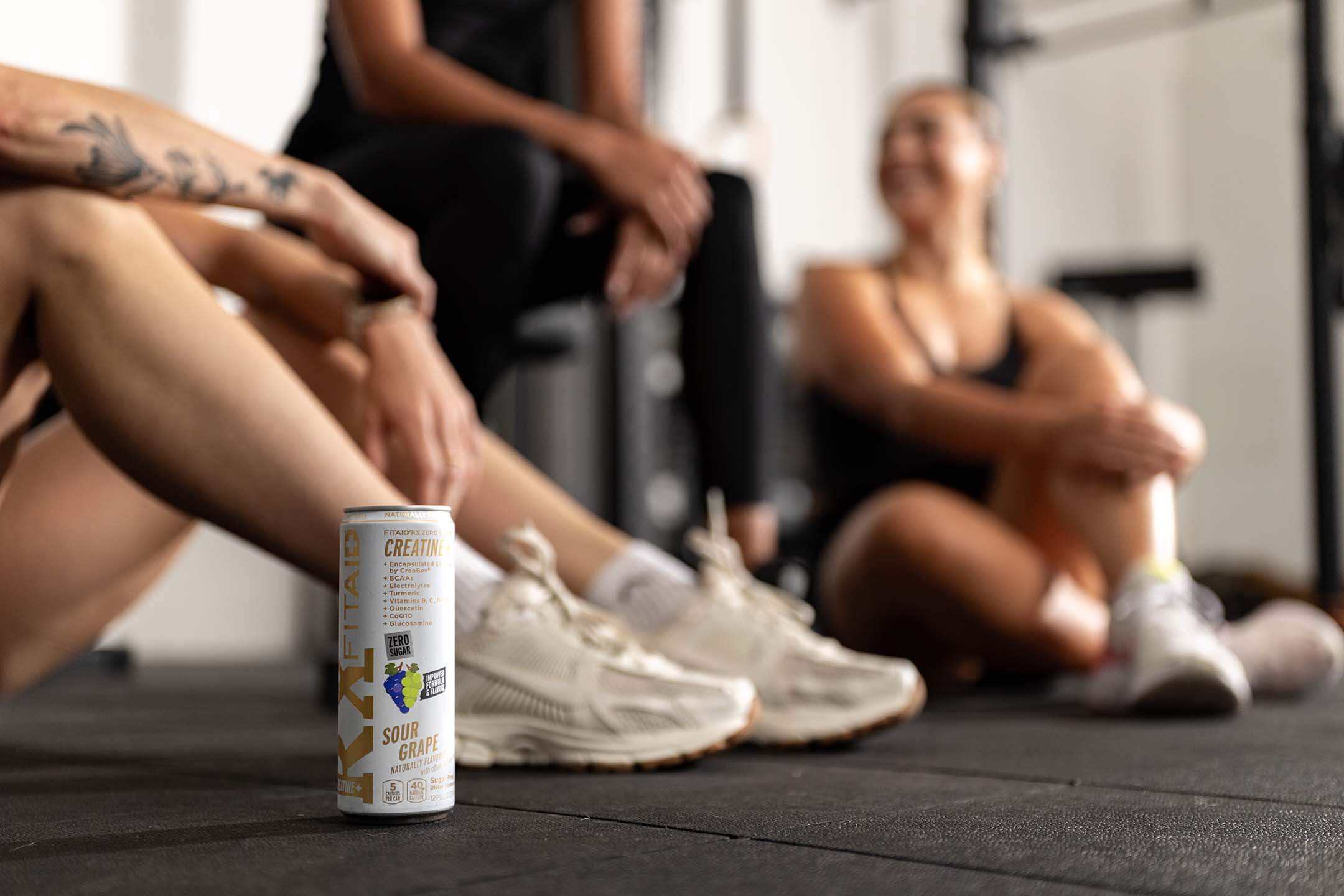 Kelsey Kiel drinking a can of FITAID RX Zero.